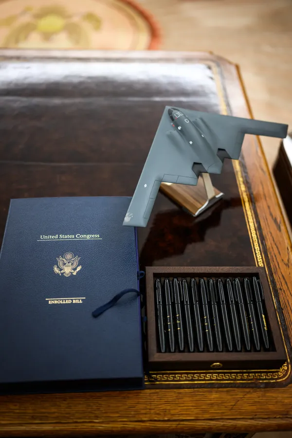 Funding bill ending the government shutdown displayed on the Resolute Desk in the Oval Office, November 12, 2025.
